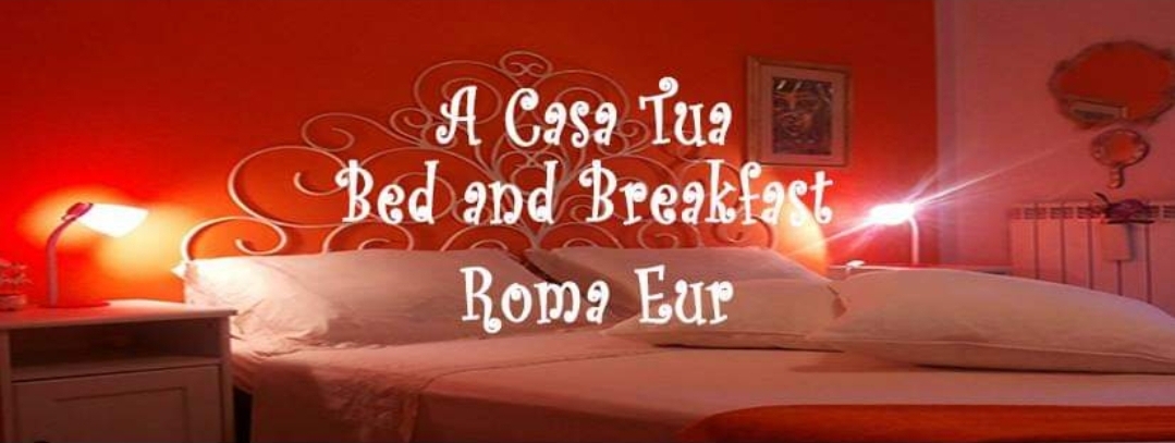 Camera del B&B A Casa Tua a Roma EUR, parete corallo e letto matrimoniale